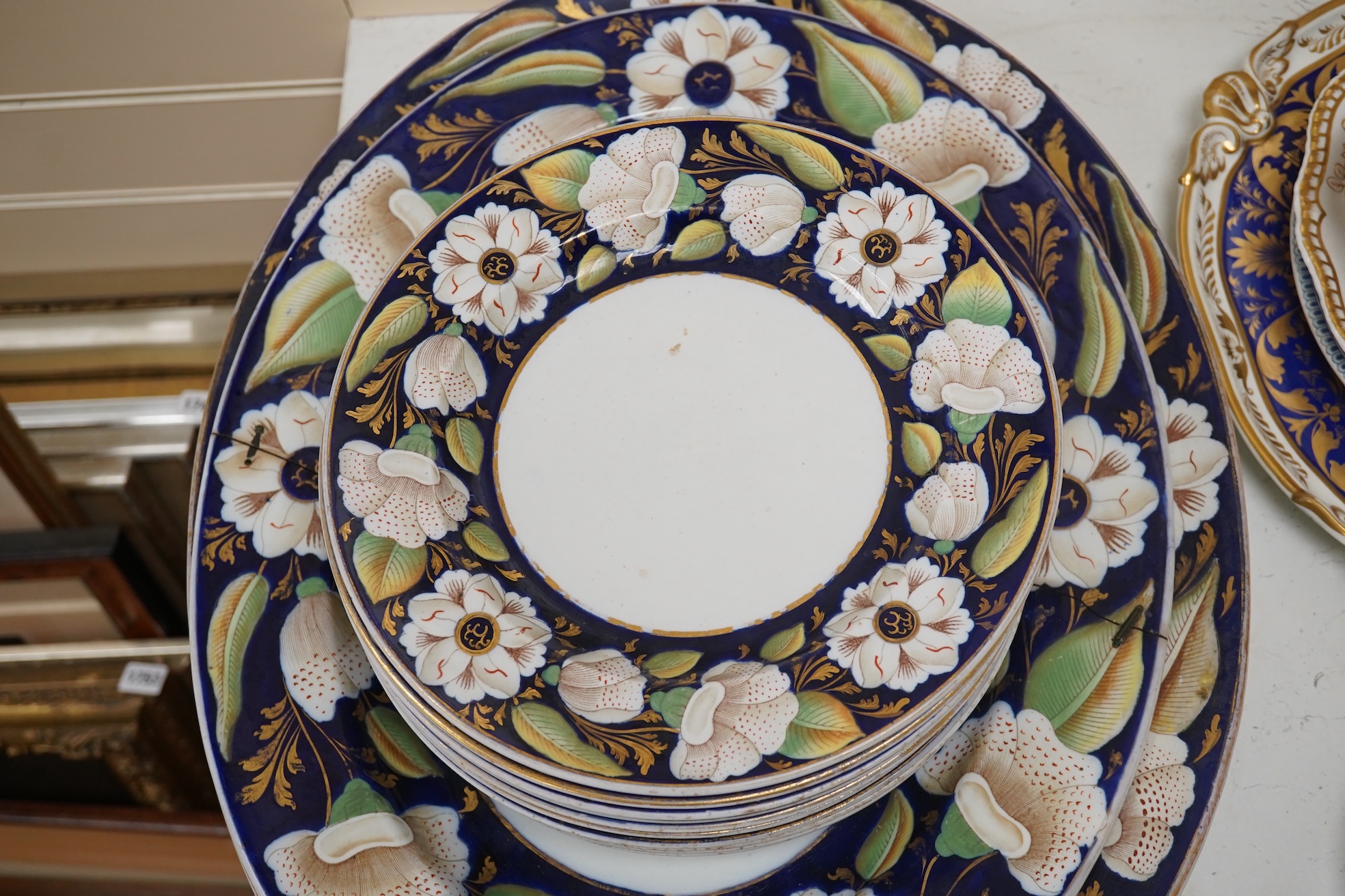 A Victorian Ironstone part set of floral decorated tableware. Condition - some items damaged